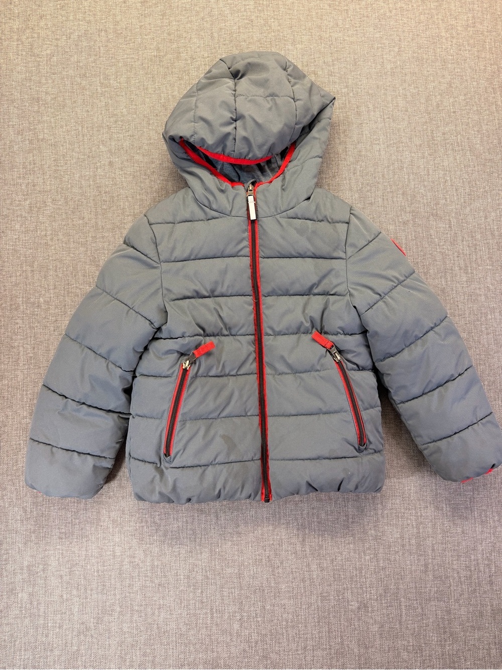 Gray Quilted Hooded Puffer Jacket with Red Trim size 6 kids.
